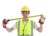 Photo: Apprentice holding builders tape measure Apprentice holding builders tape measure
