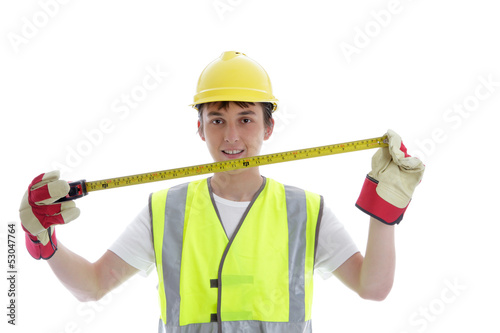Photo: Apprentice holding builders tape measure Apprentice holding builders tape measure
