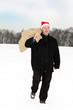 Man with cloth bag runs through the snow