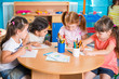 Group of cute little prescool kids drawing