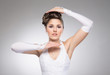 Young and beautiful bride over the grey background