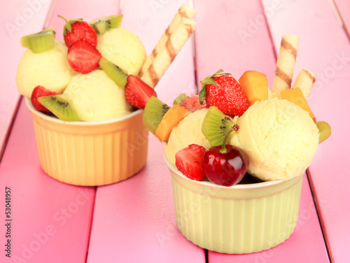 Photo: Delicious ice cream with fruits and berries in bowl Delicious ice cream with fruits and berries in bowl