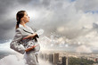 Businesswoman holding alarmclock