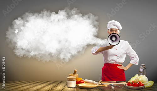 Photo: Asian female cook holding megaphone Asian female cook holding megaphone