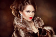 Photo: Luxury girl. Beautiful Woman wearing in Luxury Fur Coat. Jewelry Luxury girl. Beautiful Woman wearing in Luxury Fur Coat. Jewelry