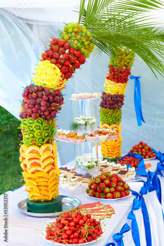 Photo: colorful fruit and cake decoration on banquet party colorful fruit and cake decoration on banquet party