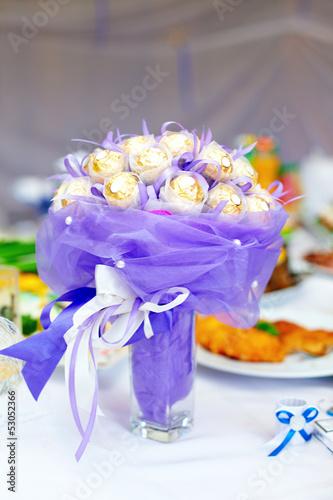 Photo: sweet candy flower bouquet on setting table sweet candy flower bouquet on setting table