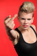 Fashion teenager girl showing middle finger
