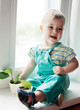 little boy exploring plant