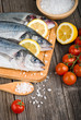 Fresh sea bass on chopping board