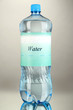 Water bottle with label on grey background