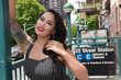 Cute girl poses by Subway in NYC