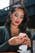 Businesswoman texting on coffee break in NYC
