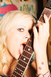 Woman Licking Guitar