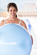 Fit woman with a Pilates ball