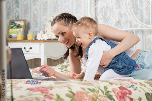 Photo: Mother with small baby. Mother with small baby.