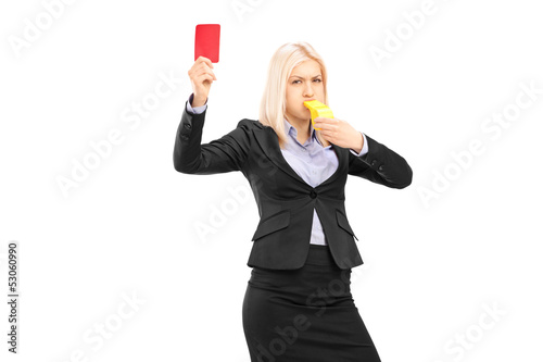 Photo: Angry businesswoman blowing a whistle and showing a red card Angry businesswoman blowing a whistle and showing a red card