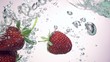 Fresh strawberry under water with a splash. 