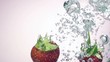Fresh strawberry under water with a splash. 