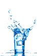 Blue water splashes in the glass on white background