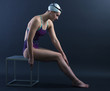Portrait of a swimmer on a dark background.
