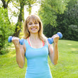 Photo: Woman exercising with dumbbells Woman exercising with dumbbells