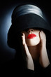 Woman in hat with red lips