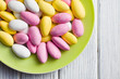 sugared almonds on green plate