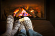 Photo: Feet warming by fireplace Feet warming by fireplace