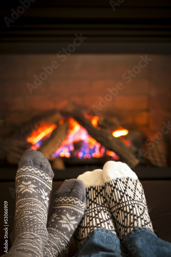 Photo: Feet warming by fireplace Feet warming by fireplace