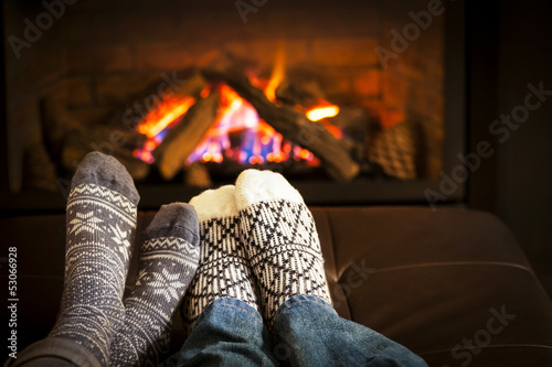 Photo: Feet warming by fireplace Feet warming by fireplace