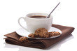 Hot chocolate in white cup on brawn table-napkin isolated on whi