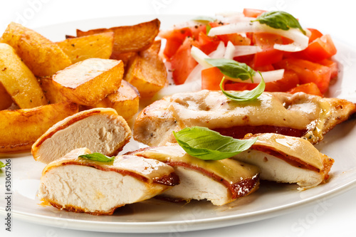 Photo: Grilled chicken breasts with cheese and baked potatoes Grilled chicken breasts with cheese and baked potatoes