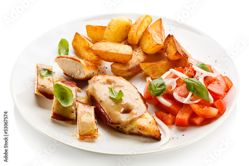 Photo: Grilled chicken breasts with cheese and baked potatoes Grilled chicken breasts with cheese and baked potatoes