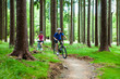 Two women riding bikes