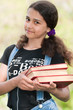 Teen girl with books on nature