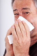 Man with a paper handkerchief