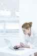 Young woman using laptop at home