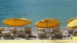 Lounge chairs and parasol on the beach, southern France