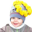 portrait of a smiling boy in a wreath of dandelions