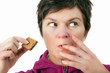 Foto: Woman eating biscuit Woman eating biscuit