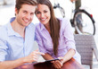 Couple Using Digital Tablet Ou...