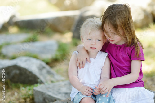 Photo: Portrait of two little sisters Portrait of two little sisters