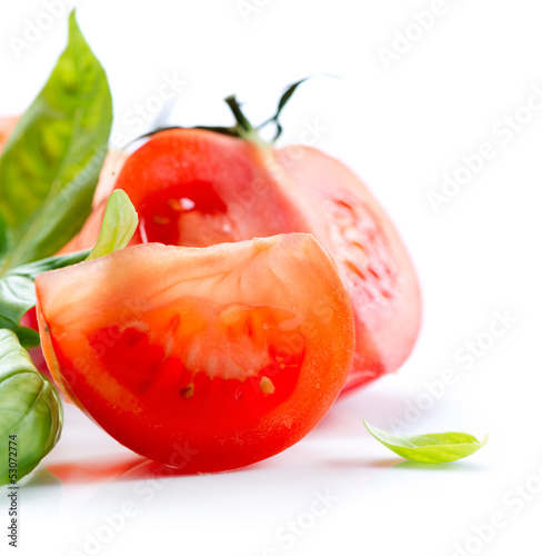 Photo: Fresh Tomatoes isolated on a White Background Fresh Tomatoes isolated on a White Background