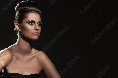Photo: Beautiful young woman with evening makeup Beautiful young woman with evening makeup