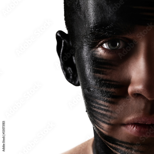 Photo: Handsome guy with artistic black shadow on his face Handsome guy with artistic black shadow on his face