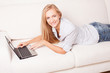 Woman on the sofa with laptop