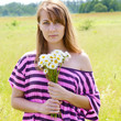 Woman with chamomiles
