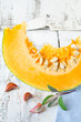 A piece of fresh pumpkin , sage and garlic
