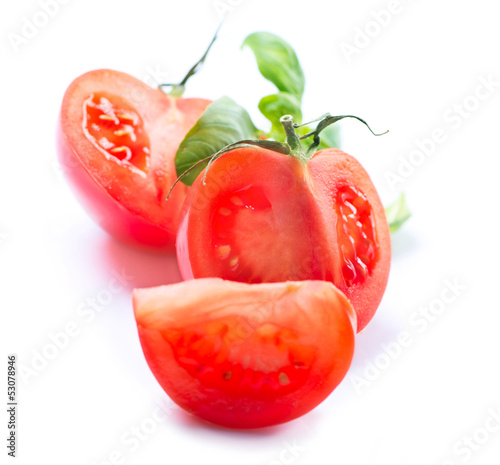 Photo: Fresh Tomatoes isolated on a White Background Fresh Tomatoes isolated on a White Background